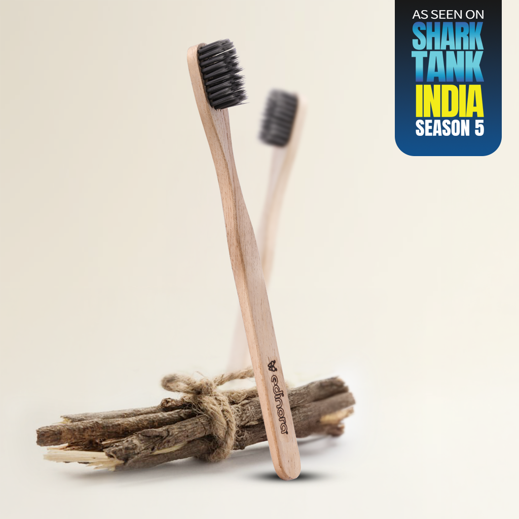 Edinora soft toothbrush with clove infused neem wood handle - tapered, charcoal infused bristles