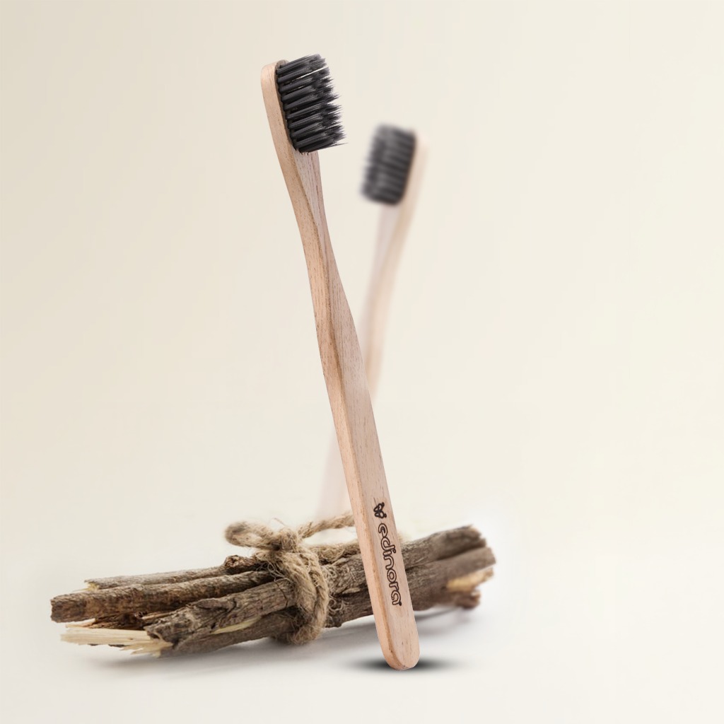 Edinora soft toothbrush with clove infused neem wood handle - tapered, charcoal infused bristles